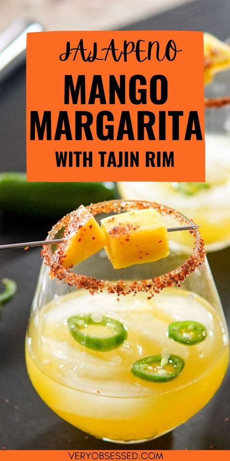 Jalapeno Mango Margarita in a Stemless glass with Tajin Rim and Fresh Mango garnish Jalepeno Mango Margarita, Mango Spicy Margarita, Cocktails With Tajin Rim, Mango Margarita Recipe On The Rocks, Tajin Drink Recipes, Spicy Tequila Drinks, Spicy Margarita Recipe Easy, Easy Margarita Recipes On The Rocks, Tajin Cocktails