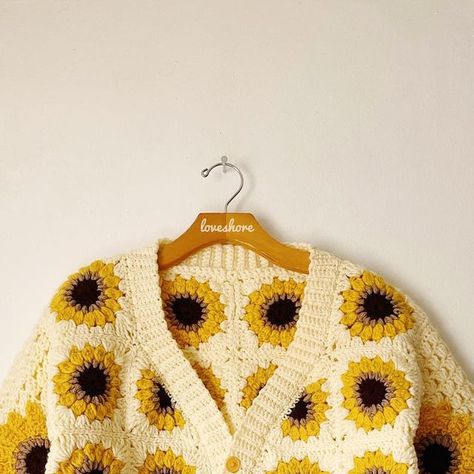 LOVESHORE on Instagram: "Sunflower Cardigan 🌻🤍 Starting off cardigan season, I had to create another addition to my sunflower designs with this beauty. This cropped v-neck button up cardigan features sunflower granny squares and mesh sleeves with sunflower appliqués. 🌻💛 More exciting photos will be posted soon. 🤩" Sunflower Crochet Cardigan, Sunflower Cardigan, Sunflower Designs, My Sunflower, Sunflower Crochet, Button Up Cardigan, Sunflower Design, Mesh Sleeves, Granny Squares