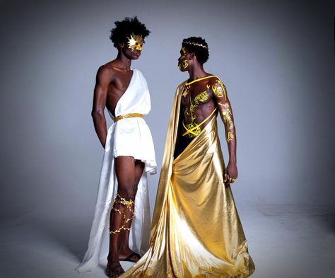 Black male models dressed as the sum and moon Sun Costume Man, Sun God Outfit Male, Sun Themed Outfits Male, Sun God Costume, Greek God Outfits Men, Greek Fashion Men, Sun And Moon Outfit, Greek God Costume Male, Greek Inspired Fashion