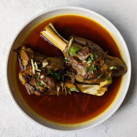 Nalli Nihari – Prepare traditional homestyle Pakistani nalli nihari by simmering lamb shanks, homemade nihari masala, and aromatics for a soothing comfort meal perfect for special gatherings and cozying up … The post Nalli Nihari appeared first on Jamil Ghar. Nalli Nihari, Lamb Shank Stew, Nihari Recipe, Thick Stew, Pakistani Dishes, Beef Shank, Using A Pressure Cooker, Lamb Shanks, Chapati