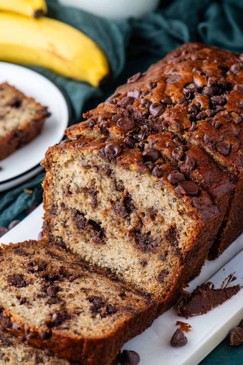 This chocolate chip banana bread recipe is a spin on my original recipe, which I have been told is the best banana bread in the world. With just 10 minutes of prep and simple pantry ingredients, you've just found your new go-to favorite banana bread recipe! Banana Bread Recipe With Walnuts And Chocolate Chips, Banana Chocolate Chip Nut Bread, Banana Nut Bread With Chocolate Chips, Banana Chocolate Chip Bread Recipe, Banana Walnut Chocolate Chip Bread, Banana Bread Recipe Chocolate Chip, Banana Chocolate Chip Bread, Chocolate Chip Bread Recipe, The Best Banana Bread Recipe