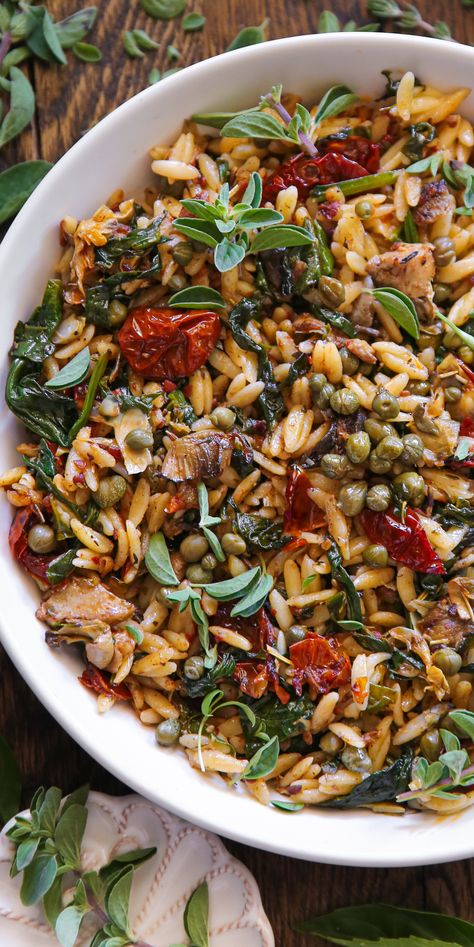 Sun-Dried Tomato Orzo with Spinach, Artichokes, and Capers - in a white bowl. Orzo With Capers, Winter Orzo Salad Recipes, Mediterranean Diet Artichoke Recipes, Healthy Vegetarian Salads, Leftover Orzo Recipes, Spinach Mushroom Orzo, Veg Side Dish, Orzo Recipes Dairy Free, Orzo Vegetarian Recipes