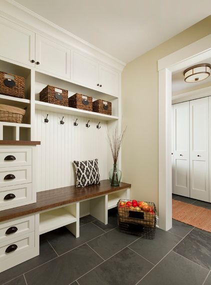 Here's a great article about mud rooms.  We don't call them mud rooms in the Carolinas because we don't need a lot of heavy coats or boots.  These rooms are drop zones in Charlotte. Great places to stow book bags and sporting gear. Traditional Entry, Mudroom Cubbies, Farmhouse Mudroom, Armoire Entree, Mud Room Entry, Mudroom Organization, Mudroom Entryway, Condo Remodel, Mudroom Decor