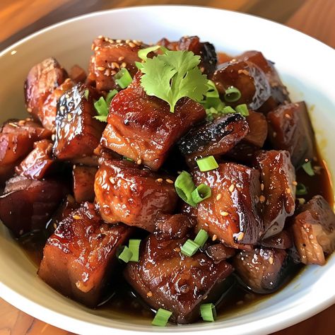 🍖 Dive into the rich flavors of Humba, a Filipino braised pork belly dish! 🌟 #ComfortFood Humba Ingredients: Pork belly (2 lbs) Soy sauce (1/2 cup) Vinegar (1/4 cup) Brown sugar (1/3 cup) Garlic, minced (1 tbsp) Bay leaves (3) Peppercorns (1 tsp) Salted black beans (1/4 cup) Water (2 cups) Instructions: Marinate pork belly in soy sauce, vinegar, and garlic for at least 1 hour. In a pot, place the pork and marinade, add water, brown sugar, bay leaves, peppercorns, and black beans. Bring to... Braised Pork Belly, Instagram Recipes, Twisted Recipes, Marinated Pork, Braised Pork, Trending Recipes, Bay Leaves, Pork Belly, Black Beans