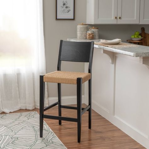 Immerse yourself in the captivating blend of midcentury modern design and farmhouse allure with the Powell Clara Barstool Set. Crafted from solid rubberwood, these barstools promise exceptional durability and stability, ensuring they withstand the test of time. The handwoven rope seat adds a rustic touch, offering both comfort and style, while the matte black stain on the streamlined frame enhances their sleek, sophisticated appearance. Standing at a perfect seat height of 29 inches, these stool Rustic Comforter, Brown Bar Stools, Modern And Traditional Decor, Black Bar Stools, Wood Counter, Modern Bar Stools, Modern Bar, Kitchen Bar Stools, Furniture Legs