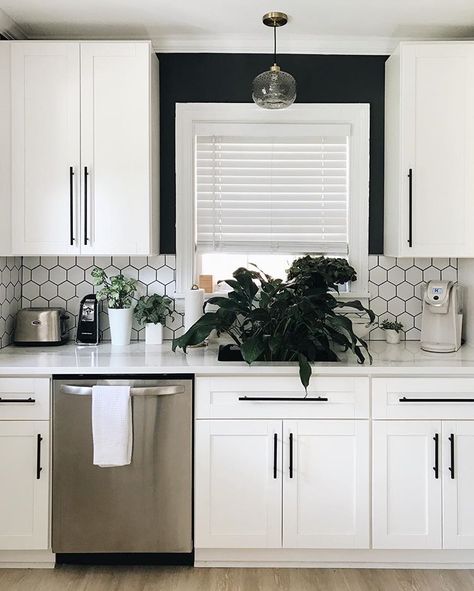 White Kitchen Black And White Backsplash, White Kitchen With Colour Pop, White Cabinets Hexagon Backsplash, Cabinets To Go Malibu White, Painted Kitchen Cabinets Black Hardware, Black And White Kitchen Cabinets Painted, Black Modern Kitchen Hardware, White Black Backsplash, Malibu White Shaker Cabinets