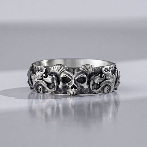 [AffiliateLink] If You Love Skull Rings, You'll Love This One! This Skull Ring Is Perfect Anyone Interested In Skulls, Bones And Things Gothic. The Ideal Men's Jewelry Gift That Expresses Your Unique Personality, As Well As Making A Great Gift For Him Or Her. The Hammered Back Design Makes This Ring Appropriate For Almost Any Occasion. This Is The Perfect Choice For Someone Who Wants Something Simple But With A Lot Of Character! With An Antique Style Oxidized #mensjewelryringsunique Goth Engagement, Goth Wedding Ring, Fantasy Punk, Goth Engagement Rings, Ring Silver Men, Jewelry Rings Unique, Gothic Wedding Rings, Biker Ring, Skull Wedding Ring