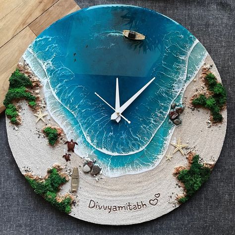 This wall clock is a handcrafted decorative clock that features a breathtaking image of an island, ocean and waves, beach and rocks. The clock is made of epoxy resin and includes a miniature boat, seashells, starfish, and multiple resin turquoise waves. PLEASE NOTE: The clock mechanism is a delicate and complex part of the product. Due to the risk of damage during transportation, the clock mechanism is included in the package but not assembled beforehand. This way, you can ensure that the clock Sea Resin Wall Clock, Resin Ocean Clock, Ocean Art Resin, Resin Clock Diy, Resin Art Clock, Ocean Clock, Sea Resin, Epoxy Wall Clock, Beach Resin Art