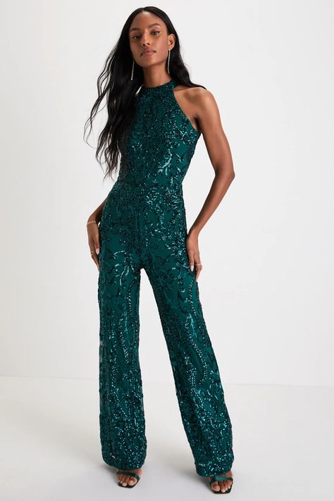 For a look that'll cause some commotion, slip into the Lulus Exceptional Glam Emerald Green Sequin Wide-Leg Halter Jumpsuit! This head-turning jumpsuit has a mesh knit composition, adorned with an intricate sequin design throughout, that shapes a modified halter neckline and a sleeveless bodice. High, fitted waist sits atop wide pant legs that fall to ankle-length hems. Button-loop closures secure atop a U-shaped cutout at the back. Hidden back zipper/clasp. Emerald Green Jumpsuit, Satin Jumpsuit, Sequin Jumpsuit, Halter Jumpsuit, Lulu Fashion, Sequin Design, Green Jumpsuit, Adhesive Bra, Green Sequins