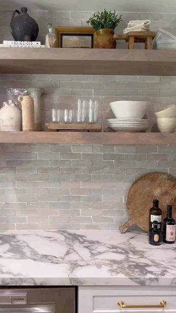 Riad Tile on Instagram: "We hope your weekend plans are as breathtaking as @byangelarose kitchen transformation. Our Natural White 2x6 Zellige featured as the backsplash makes a great pair with that beautiful backyard view. Available online now in the new thinner version. 🎞️: @byangelarose #riadtile #riadtilezellige #zelligenaturalwhite26riadtile #whitetiles #kitchenbacksplash #kitchendesign #kitchenremodel #transformation #interiorstyling #openshelving #weekendvibes #tgif" Gray Zellige Tile Backsplash, Riad Natural White Zellige, Riad Tile Natural White Zellige, Circle Kitchen, Riad Tile, Backyard View, Backyard Views, Shelving Ideas, Kitchen Transformation