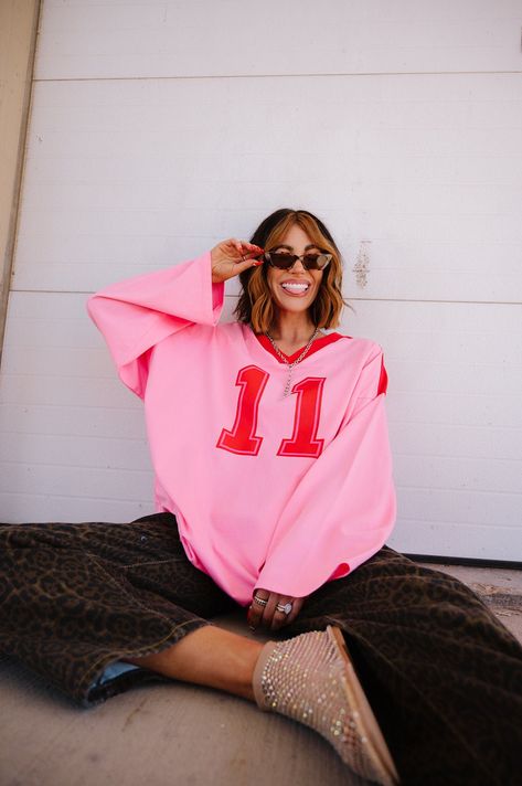 Lucky Oversized Jersey Tee in Red + Pink Game Day Fashion, Christmas Graphic Tee, Pink Jersey, Merch Photoshoot, Oversized Pink Top With Graphic Design, Oversized Red Sweatshirt With Graphic Print, Graphic Sweatshirt Outfit, Oversized Pink Sweatshirt With Slogan, Pink Graphic Print Athleisure T-shirt