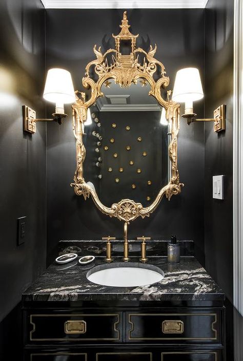 Gold and black powder room boasts walls painted bold black lined with a gold chinoiserie mirror ... Black Powder Room, Chinoiserie Mirror, Gold Bad, South Shore Decorating, Revere Pewter, Gold Bathroom, Classic Bedroom, Trendy Bedroom, Natural Home Decor