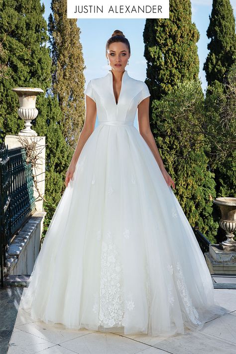 The overall feel of this fit and flare Mikado wedding gown is classic with a modern twist. A notch collar and seaming adorn the clean bodice. Appliqués are placed throughout the detachable tulle ball gown skirt. Two looks in one make this style perfect for your big day. Justin Alexander Bridal, Mikado Wedding Dress, Justin Alexander Wedding Dress, High Neck Wedding Dress, Satin Wedding Gown, Cheap Wedding Dresses Online, Lace Ball Gowns, Justin Alexander, Wedding Dress Pictures