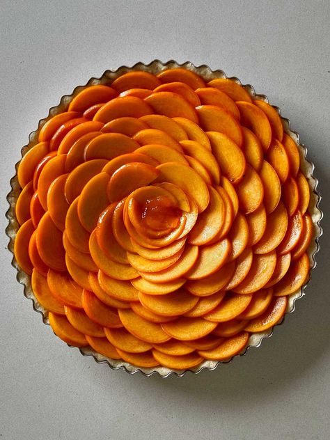 This showstopper persimmon tart is surprisingly simple to make and arranging the slices into a rose makes it more than impressive. Persimmon Tarte Tatin, Persimmon Cheesecake, Persimmon Galette, Persimmon Pie, Persimmon Tart, Persimmon Dessert, Persimmon Aesthetic, Persimmon Cake, Persimmon Pie Recipe