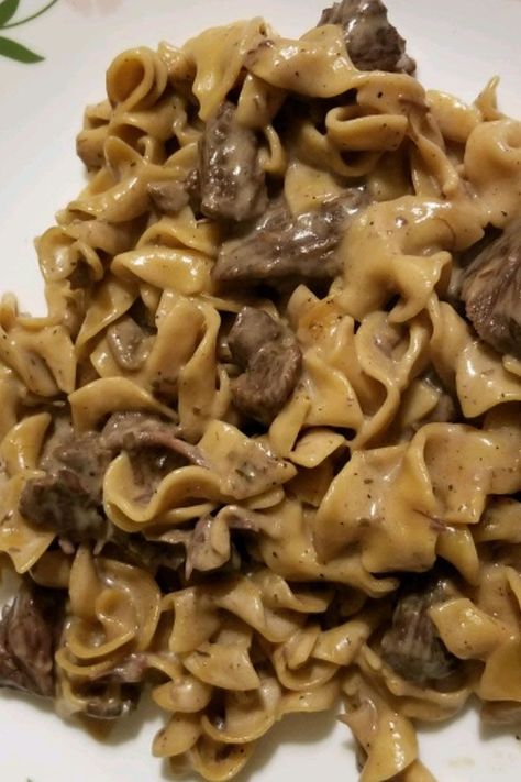 This instant pot beef stroganoff is a quick and easy beef stroganoff recipe! Cook the best instant pot beef recipe using beef stew meat, mushrooms, egg noodles, and sour cream. You will love cooking this beef stroganoff recipe for an easy dinner! Instant Pot Beef Stroganoff Stew Meat Cream Of Mushroom Soup, Instant Pot Stroganoff Stew Meat, Instant Pot Beef Stroganoff Easy, Insta Pot Beef Stroganoff Recipe, Instant Pot Beef Stroganoff With Cream Of Mushroom Soup, Beef Stroganoff Pressure Cooker, Insta Pot Beef Stroganoff Easy, Beef And Noodles Instant Pot Stew Meat, Beef Stew Meat Stroganoff