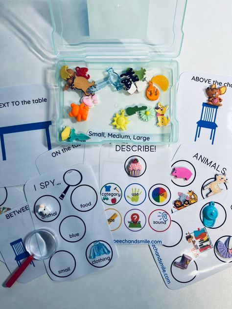 Say & Play LANGUAGE TASK BOX! Kit includes: ~Portable compact case ~10 laminated language card tasks ~25 Mini Objects (vary per kit) This mini kit is perfect to pull out when you are working with a younger child and small groups. The task box  targets language areas, such as describing, spatial concepts, size, and an I spy activity mat! The mini objects have a variety of uses beyond the task box! Use the objects for articulation, sensory bins, I spy, games, and more! Warning... Small parts,  a c Speech Therapy Sensory Activities, Diy Speech Therapy Materials, Elementary Speech Therapy Activities, Asd Activities, Receptive Language Activities, Aba Therapy Activities, Language Concepts, Speech And Language Activities, Speech Therapy Activities Language