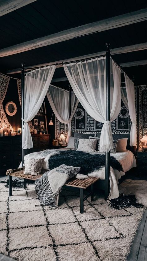 A cozy and stylish black boho-style bedroom. The room is adorned with dark wood furniture and cozy textiles, including a large canopy bed draped in black and white fabrics. A plush area rug covers the floor, and the walls are decorated with intricate black and white patterns. The room exudes a chic and relaxed ambiance, with plenty of candles and fairy lights adding to the cozy atmosphere., photo Black Bohemian Bedroom, Black Canopy Bedroom Ideas, Black Boho Bedroom, Canopy Bed Drapes, Black Boho Style, Black Canopy Bed, Cozy Textiles, House Bedroom Ideas, Black And White Patterns