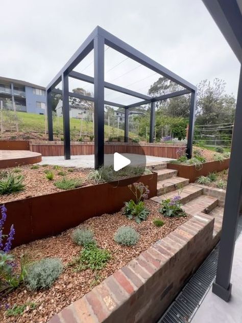 Jake Baturynsky on Instagram: "🌱 Filling in 🌱 A favourite from this year filling in nicely. A tight space out the back of another wicked @diggerbrothersbuilding build with a design by us creating a formal dining and fire pit area surrounded by tough but beautiful plantings that can survive the the harsh variation in client at Gerroa!!!! . . . . #landscape #landscapedesign #landscapedesigner #garden #gardendesign #gardendesigner #green #illawarra #southcoast #plants #outdoor #outdoorliving #outdoorlife #greenroom #pergola #bricks #paving #succulents #steel #edging #corten #cortensteel #flower #flowers @steel.edge @ideal_edging @alderwoodnursery @alleralight @thebrickpit @gerringonghardware @artisanexterior.au @anthonynabbe17 @mason.tvh" Landscape Seating, Steel Edging, Terrace Garden Ideas, Garden Desig, Steel Pergola, Brick Garden, Plants Outdoor, Steel Bed, Fire Pit Area