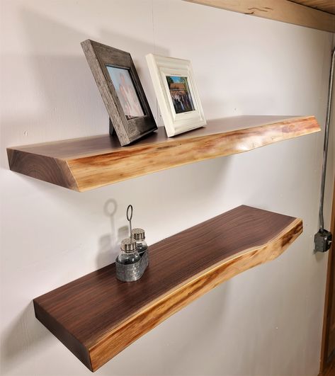 "ZimBoards WALNUT FLOATING SHELVES FEATURE: * 2\" Thick, Solid \"Character-Grade\" Pennsylvania Black Walnut full of beautiful wood character and color * The natural Live-Edge reveals the under-bark surface of the tree  * 50 pound per wall stud weight capacity * Lustrous Catalyzed Conversion Varnish Finish (Satin / 20-sheen) -     maintenance-free, scratch & water resistant  * Custom In-stock & Made to Order * Handmade in Lancaster County Pennsylvania USA YOUR CHOICE OF: * Shelf Width from 12\" Hatural Edge Wood Shelf Over Bed, Black Walnut Floating Shelves, Rough Edge Wood Shelves, Live Edge Board Shelf, Live Edge Vertical Shelf, Walnut Wood Projects, Tree Bookcase, Walnut Floating Shelves, Live Edge Shelves