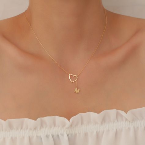 "You can buy this Letter Hanging From Heart Necklace as a unique gift for yourself or your loved ones, This precious dainty  Necklace on your neck will remind you of countless meanings and feelings that no one else can know. We know the value of every letter or name on the chain to you. We know that it will be more than a necklace for you, from the moment we receive the order for it. We produce our products with extraordinary enthusiasm and respecting the stories they contain. Remember, Your Design will be Your Story. Material; High Quality 925 Sterling Silver Color; Gold, Silver,  Rose Chain Length; 14\" , 16\" , 18\", 20\", 22\" (There is an extra 3 cm extension on the chain.) Our products are meticulously handcrafted by design and jewelry experts in our workshop, which works with advanc Heart Necklace With Initial, Cute Clavicle Chain Necklace For Mother's Day, Cute Clavicle Chain Jewelry For Valentine's Day, Charming Clavicle Chain Jewelry As Gift, Valentine's Day Gift Jewelry, Initial Pendant, Heart-shaped Name Necklace With Charm As Gift, Heart Shaped Name Necklace With Heart Charm As Gift, Heart Shape Name Necklace With Heart Charm As Gift, Heart Shaped Charm Necklace As Gift