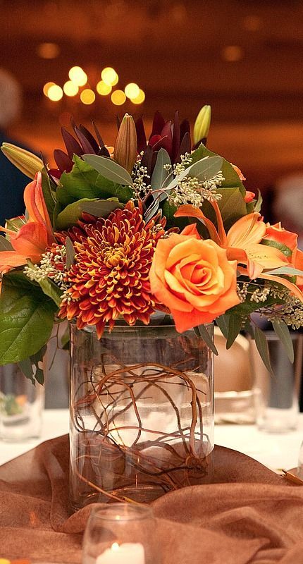 Love the fall floral colours of this centrepiece. #centrepiece http://www.aftershocksinteriordecorating.com Dollar Tree Wedding Centerpieces, Tree Wedding Centerpieces, Dollar Tree Wedding, Tafel Decor, Fall Flower Arrangements, Flowers And Greenery, Fall Floral Arrangements, Fall Wedding Centerpieces, Fall Wedding Flowers