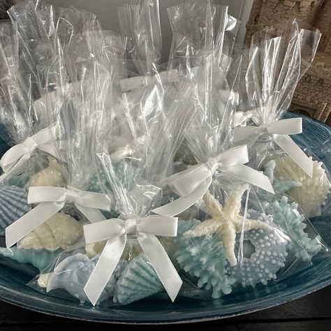 "Give her something unique with our delicately crafted seashell soap favors! These handmade mini soaps uniquely adorn any destination wedding or beach wedding or can serve as a bridal shower gift for her. Get your guests talking with these wonderfully scented little ocean decor guest soaps. Guests will love the creaminess of each goat milk soap and be charmed by the elegance of these miniature works of art. Make your big day or that special someone's day even more special with nautical decor tog Beach Wedding Gift Bags, Beach Bridal Shower Favors, Seashell Soap, Mermaid Bridal Showers, Beach Theme Wedding Favors, Pool Party Favors, Beach Wedding Centerpieces, Beach Bridal Showers, Beach Themed Party