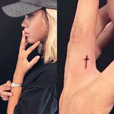 Sofia Richie Cross Finger Tattoo | Steal Her Style Cross Finger Tattoo, Pretty Cross Tattoo, Cross Finger Tattoos, Tiny Cross Tattoo, Cool Finger Tattoos, Thumb Tattoos, Your The Best, Diy Tattoo Permanent, Cute Finger Tattoos