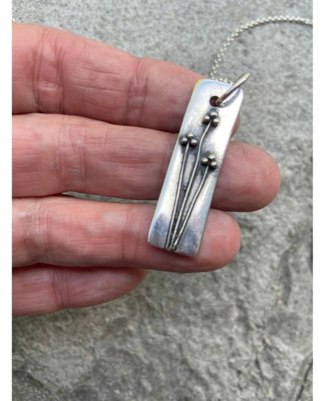 🌸 Give your mom the gift of elegance with our Floral Pendant Sterling Silver Bar Necklace! 🎁 Handcrafted with care and oxidized for a unique finish, this branch necklace is sure to make her feel special. 💕 Perfect for any occasion, it's now on sale for only $127.20! 💰 Don't miss out on this beautiful piece. ✨ #mothersday #jewelry #handmade #floralpendant #sterlingsilver #oxidizedjewelry #giftforher #artisan Pmc Jewelry, Silversmith Jewellery, Handmade Silver Jewellery, Branch Necklace, Silver Bar Necklace, Metal Clay Jewelry, Necklace Flower, Jewelry Picture, Floral Pendant