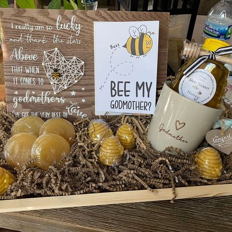 How cute is this little bee themed godmother gift set up featuring my 'Bee My Godmother' card 😍 "The card worked perfect for my bee themed Godmother gift. I was super happy with the quality of the card." Tanya, Etsy 👉🏻 https://www.teepeecreations.co.uk/product/cute-godmother-proposal-bee-card/ #TeePeeCreations #Bee #Godmother #SmallBusiness Ask To Be Godmother Ideas, Godmother Ideas, Godmother Proposal, December Birthday, Bee Cards, Modern Card, Godmother Gifts, Simple Website, Christmas Post