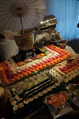 Tiered display of sushi and sashimi Luxury California, Sushi And Sashimi, Tiered Display, Sushi Boat, Food Art Painting, Asian Flowers, Inside Weddings, Snack Table, Kosher Recipes