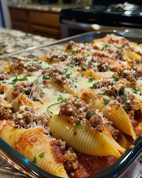 ITALIAN SAUSAGE STUFFED SHELLS 🇮🇹🧀 Ingredients: 20 jumbo pasta shells 1 lb Italian sausage, casings removed 1 cup ricotta cheese 1 cup shredded mozzarella cheese 1/2 cup grated Parmesan cheese 1 egg, beaten 2 cups marinara sauce 2 cloves garlic, minced 1 tbsp olive oil 1 tsp dried oregano 1 tsp dried basil Salt and pepper to taste Fresh parsley, chopped (for garnish) Directions: Step 1: Cook the Pasta Shells Cook the jumbo pasta shells according to package instructions until al dente. Drai... Italian Sausage Stuffed Shells, Sausage Stuffed Shells, Basil Salt, Jumbo Pasta Shells, Smoked Sausage Recipes, Dried Basil, Pasta Shells, Stuffed Pasta Shells, How To Cook Sausage