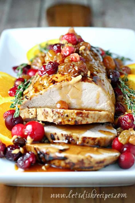 Slow Cooker Cranberry Orange Pork Tenderloin Recipe -- Pork tenderloin, slow cooked in a cranberry and orange sauce with golden raisins. The perfect holiday dinner! #pork #slowcooker Cranberry Orange Pork Tenderloin, Orange Pork Tenderloin, Tenderloin Pork, Orange Pork, Slow Cooked Pulled Pork, Tenderloin Roast, Tenderloin Recipes, Orange Sauce, Pork Loin Roast