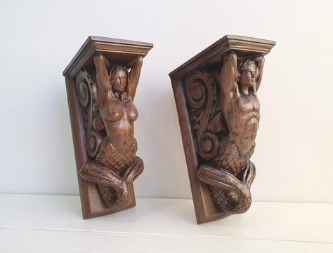 This Corbels Merman and Mermaid is an absolutely stunning piece of home decor. Made from carved wood, these pieces are perfect for adding a touch of whimsy and beauty to any room. Whether they are dyed or you leave them natural, they are sure to become a highlight. Use them as a shelf holder, decorative wall art, or a unique piece of furniture decor. Whatever you do, they are sure to add a touch of magic to your home. This beautiful mermaid and sea husband is made of wood and ready for you to pa Merman And Mermaid, Mermaid Furniture, Sculpting Tips, Mermaid Wood, Wooden Mermaid Wall Art, Wood Carved Mermaid, Wood Carved Wall Shelf, Mermaid Ship Figurehead, Shelf Holder