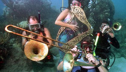 This Florida Music Festival Takes Place Completely Underwater To draw attention to coral reef conservation, divers play 'bass-oons' and 'trombonefish' at the Underwater Music Festival in Key West Underwater Music, Gilligan’s Island, Fish Costume, Lady Lake, Usa Florida, Comedy Comics, Disc Jockey, Yellow Submarine, Music Festivals