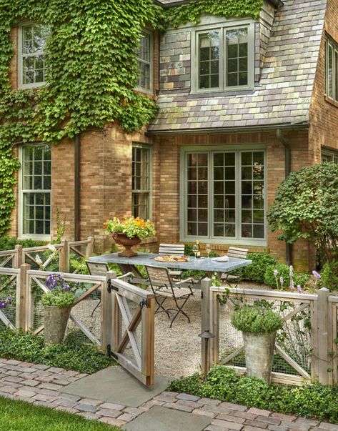 Belgian Beauty - Gardenista Fenced In Cottage Garden, English Fence Ideas, Pea Gravel Patio Front Yard, French Garden Fence Ideas, Fire Patio Ideas, Patio With Fence Around It, French Country Fence Ideas, Landscape Hedge Ideas, English Cottage Fence