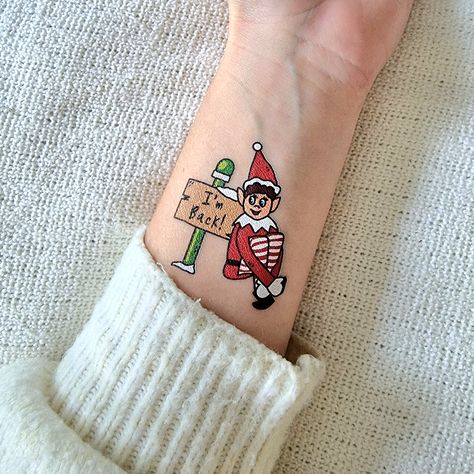 Elf On The Shelf Tattoo Ideas, Elf On The Shelf Tattoo, Elf Tattoo Design, Shelf Tattoo, Elf Tattoo, Christmas Eve Boxes, Temporary Tattoo Designs, Elf On The Shelf Ideas, Christmas Eve Box