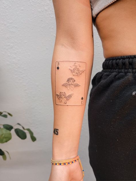 Fine line tattoo of 3 of diamonds playing card with cherubs or baby angels as symbols Playing Cards Tattoo, Playing Card Tattoo, Playing Card Tattoos, Cherub Tattoo, Angel Card, Traditional Tattoo Sleeve, Diamond Tattoos, Fine Line Tattoo, Tattoo Style Drawings