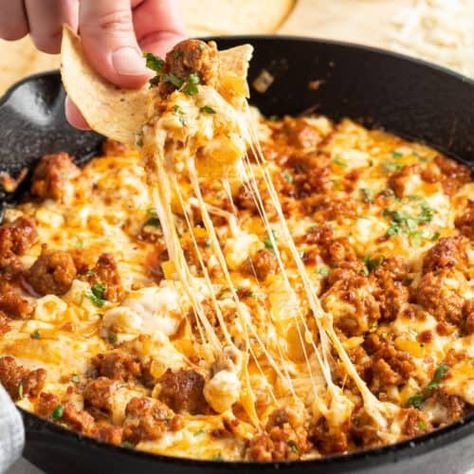 Take a trip to cheese town with this awesome Queso Fundido con Chorizo! This spicy, savory combination is everything you love about cheese dips! #BreadBoozeBacon #chorizo #quesofundido #appetizer #partyfood #cheesedip #mexicanfood #cincodemayo Chirozo Recipes, Queso Fundido With Chorizo, Recipe With Chorizo, Chorizo Recipes Dinner, Con Queso Recipe, Fundido Recipe, Pork Chorizo, Chorizo Recipe, Bread Booze Bacon