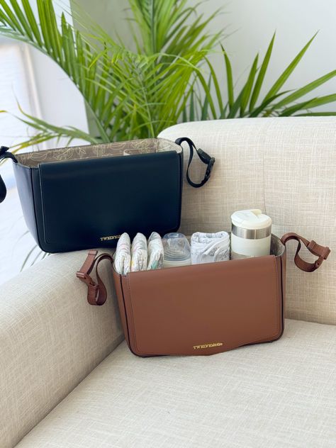 Our chic, newly updated vegan leather stroller organizer helps keep your baby items within reach while on the go. Featuring our signature Peek-A-Boo flap, you can easily grab a wipe when the situation calls for it. With enough room to store everything from sunblock to a swaddle blanket, it's the perfect caddy to fit all your quick essentials in—including your coffee cup. Dipper Bag, Stroller Caddy, Stroller Organizer, Organization Help, Swaddle Blanket, Peek A Boo, Baby Gear, New Parents, Baby Items