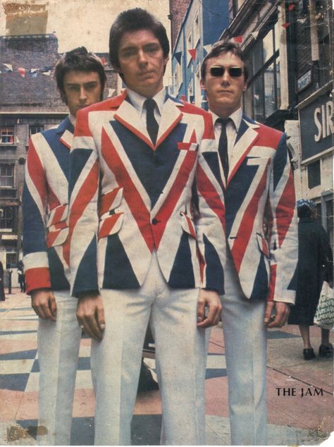 The Jam pose in Carnaby Street in the 70s wearing their Union Jack Jackets inspired by The Who in the 60s. The Style Council, Swinging London, Paul Weller, The Jam Band, Carnaby Street, Rock Festival, British Music, The Jam, British Invasion