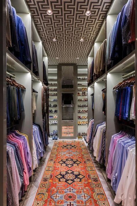 Long walk in master closet boasting an orange Kilim runner adding color and contrast to a men’s closet design. Wallrobes Designs, Glamorous Closet, Large Master Closet, Master Closet Design, Dressing Room Closet, Walking Closet, Dream Closet Design, Walk In Closet Design, Luxury Closets Design