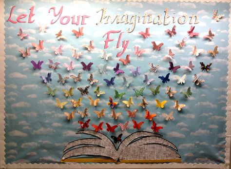 Let Your Imagination Fly: Butterflies made out of scrapbook paper flying out of a book; Butterflies are 3d, made out of layering one butterfly on top of the other and folding the wings of the top one upward; #butterflies; #bulletin board; #public library; #poetry month (April 2014) Imagination Bulletin Board, Bulletin Board Ideas With Butterflies, Wings Bulletin Board Ideas, Where Will Your Wings Take You Bulletin, Butterfly Bulletin Board Ideas, Wings Bulletin Board, Reading Gives You Wings Bulletin Board, Learning Gives You Wings To Fly Bulletin Board, Preschool Reading Area