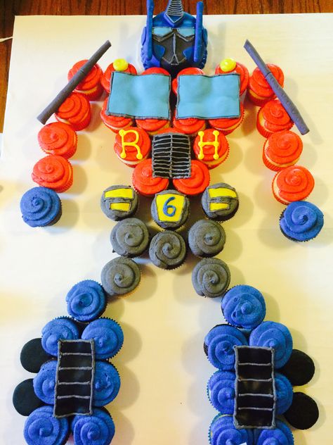 Optimus Prime cupcakes Transformer Birthday Party, Optimus Prime Cupcakes, Transformers Cupcake Toppers, Optimus Prime Cupcake Cake, Bumble Bee Cake Transformers, Bumble Bee Cupcakes Transformers, Transformers Birthday, Transformers Cupcakes, Transformers Birthday Cake Bumble Bee