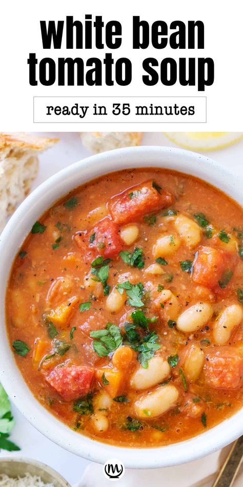 This hearty white bean tomato soup is packed with tender beans simmered in a tomato-herb broth. The lemon juice, parsley, and parmesan cheese take it over the top. #beansoup #whitebeansoup #whitebeanrecipes #souprecipes Tomato Soup With White Beans, Tomato Bean Soup, Bean Tomato Soup, Bean And Tomato Soup, White Bean Tomato, Bean Soups, White Bean Recipes, White Bean Soup Recipes, Soup Chowder