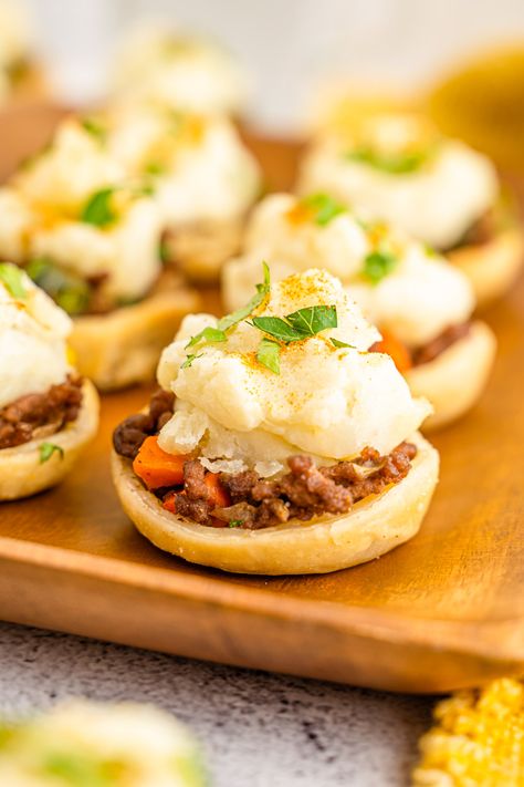 Shepherd’s Pie Bites are the mini versions of the classic comfort food! They are perfect for entertaining, and with their hearty filling and buttery mashed potato topping, they’re sure to be a hit with everyone at your party! You only need 1 hour and a handful of ingredients to make these bite-sized delights! Shepherd’s Pie has always been one of ... Read More Mini Shepards Pie, Pie Cups, Mini Pie Crust, Beef And Vegetables, Buttery Mashed Potatoes, Hearty Snacks, Fluffy Mashed Potatoes, Shepards Pie, Pie Bites