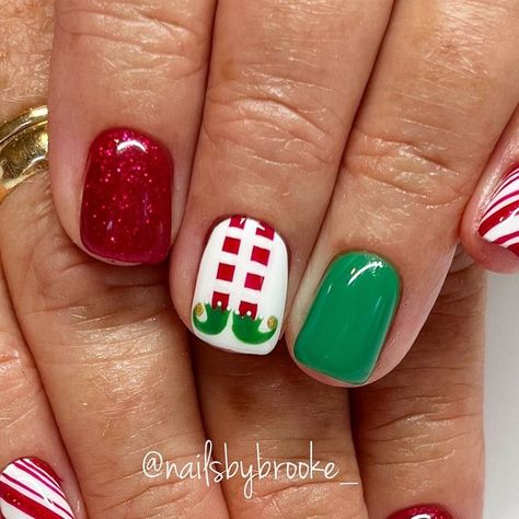 Brooke Jensen on Instagram: "These elf nails…are we kidding😍🎄👏🏼♥️ Believe it or not, this client has never seen the movie, Elf!!😱 But considering it’s in theaters for the 20th anniversary….might just be the year she finally sees it!!😏🎉 . . . . #gelpolish #handpaintednailart #naturalnailsonly #utahnailtech #utahnailartist #nailartist #nailart #naildesigns #nailartdesigns #freehandart #freehandnailart #gelnails #nails #nailmagazine #nailinspo #holidaynails #christmasnails #christmasnailart #decembernails #trendychristmasnails #festivechristmasnails #elfnails #elfnailart #elflegnails #peppermintnails #peppermintcandynails #candycanenails #candycanenailart #redglitternails #nailsbybrooke___Christmas" Elf Nail Designs, Elf Inspired Nails, Christmas Elf Nail Art, Christmas Nail Art Grinch, Buddy The Elf Nails, Grinch Nails Short, Elf Christmas Nails, Grinch Nails Designs Easy, Elf Nails Designs