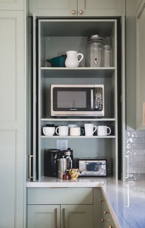 Hide away all your often-used appliances in a countertop-cabinet with pocket doors. 

Cabinet Color: Carolina Gull by Benjamin Moore Microwave Garage Cabinet, Pantry Cabinet On Countertop, Tall Appliance Cabinet, Microwave Pocket Doors, Kitchen Cabinet With Roll Up Door, Cabinets To Hide Appliances, Cabinet Hide Appliance, Hidden Countertop Appliances, Cabinets With Pocket Doors