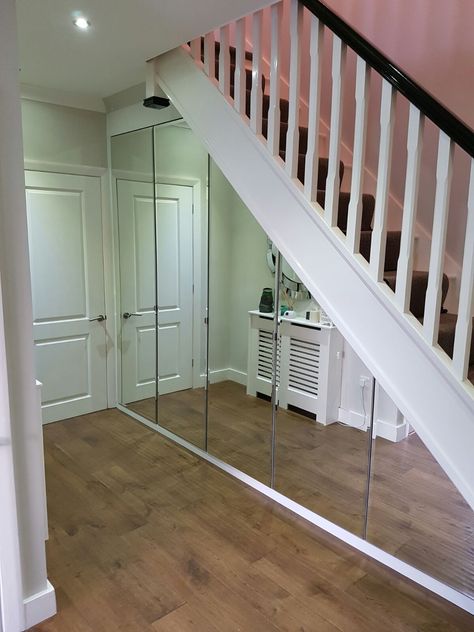 The mirror doors open up the room. Decor Under Stairs, Office Under Stairs, Storage With Mirror, Closet Under Stairs, تحت الدرج, Under Stairs Storage, Mirror Doors, Stairs Storage, Staircase Storage