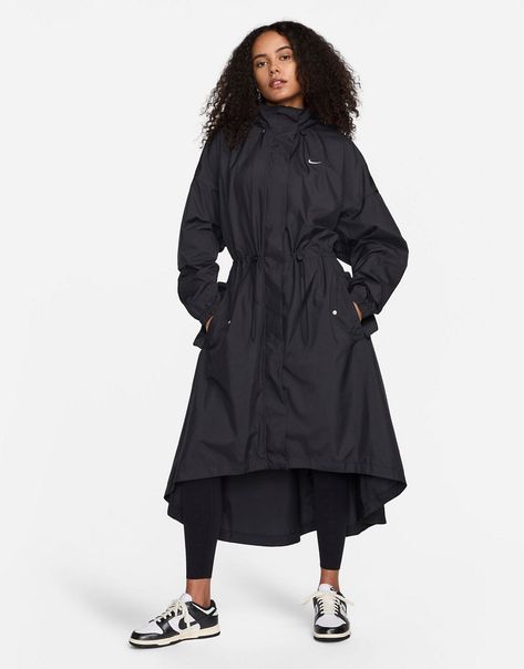 Coats & Jackets by Nike Next-level layering Toggle hood High collar Zip and snap fastening Toggle waist Side pockets Nike print too back Oversized fit Trench Coat Nike, Nike Trench Coat, Modest Workout Clothes, Modest Workout, Oversized Trench, Oversized Trench Coat, Black Trench Coat, Trench Coat Outfit, Raincoat Jacket