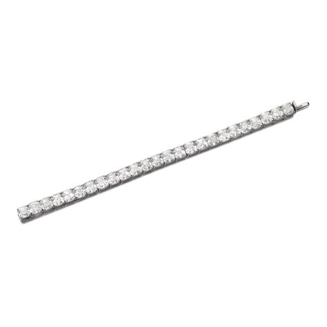 Important diamond bracelet, Graff 510,000 — 810,000 CHF 512,739 - 814,350USD LOT SOLD. 672,500 CHF (676,111 USD) Important diamond bracelet, Graff Designed as a line of square step-cut diamonds, length approximately 175mm, unsigned, numbered, case stamped Graff. White Diamond Jewelry, Sterling Bracelets, Tennis Bracelet Diamond, Diamond Bracelets, Tennis Bracelet, High Jewelry, White Diamond, Beautiful Bracelet, Diamond White